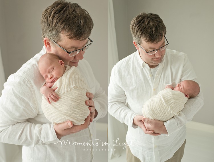 newborn baby with dad in soft and light colors