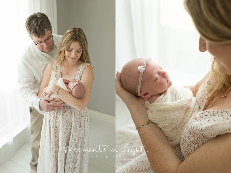 newborn baby girl with mom and dad in neutral colors