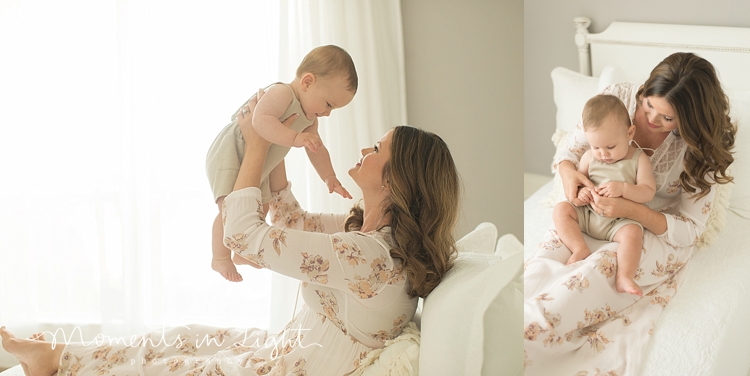 mom holding baby on white bed in Houston photo studio