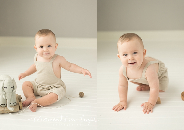 baby boy smiling wearing linen romper in Houston photo studio